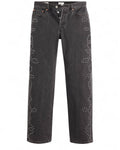 Jeans Levi's 501 Anni '90 stile vintage in denim nero con borchie decorative lungo le gambe, taglio dritto e vita media.